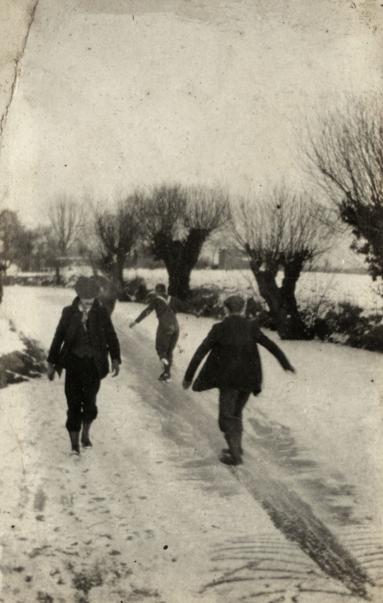 Belgium civilians and New Zealand soldiers skating on ice at Vieux Berquin, November 1916.
